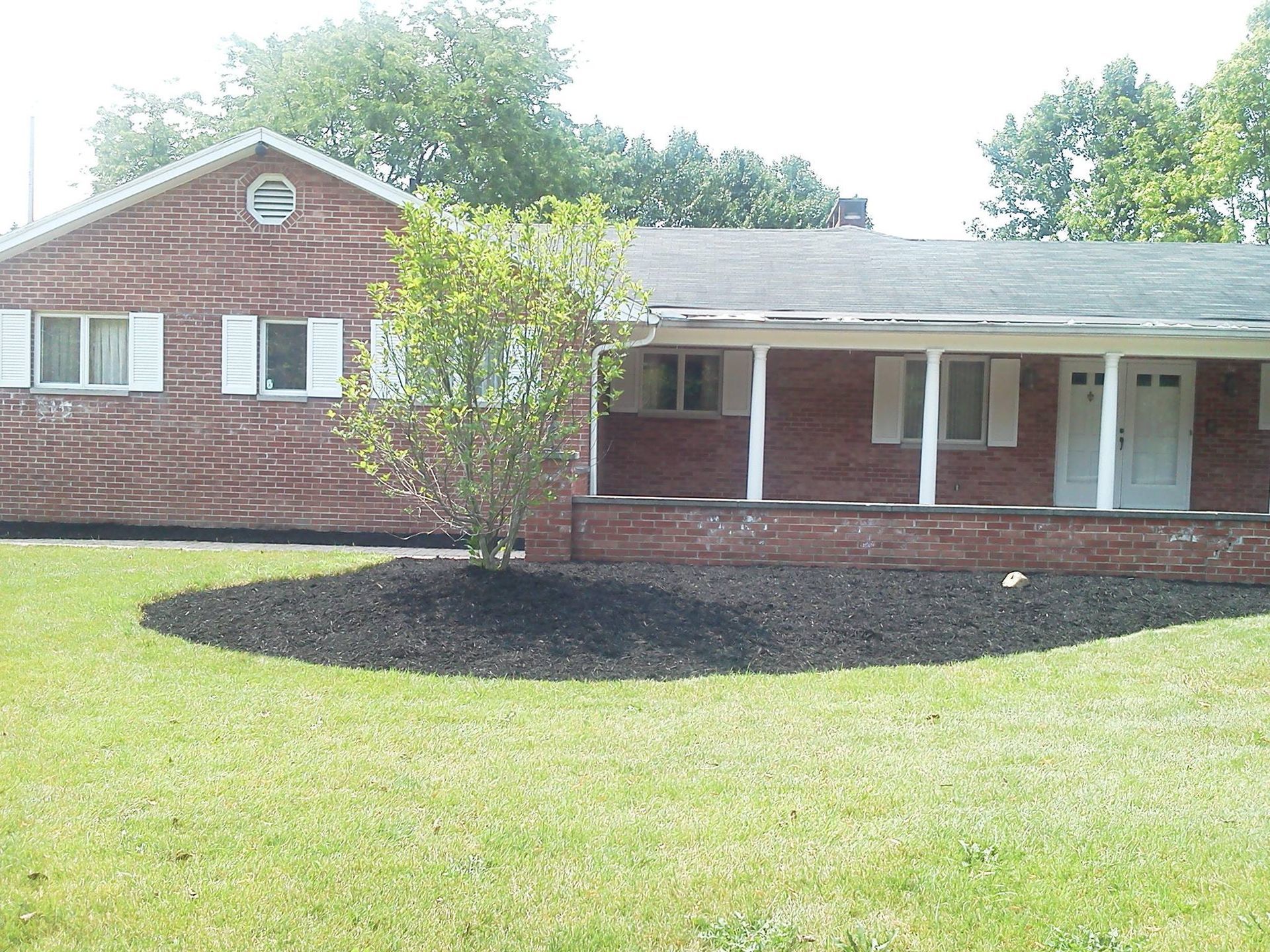 Landscaping On A Red House — Powell, OH — Dependable Landscape Services, Inc.
