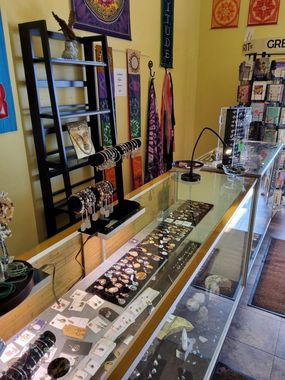 A display case filled with lots of jewelry in a store.