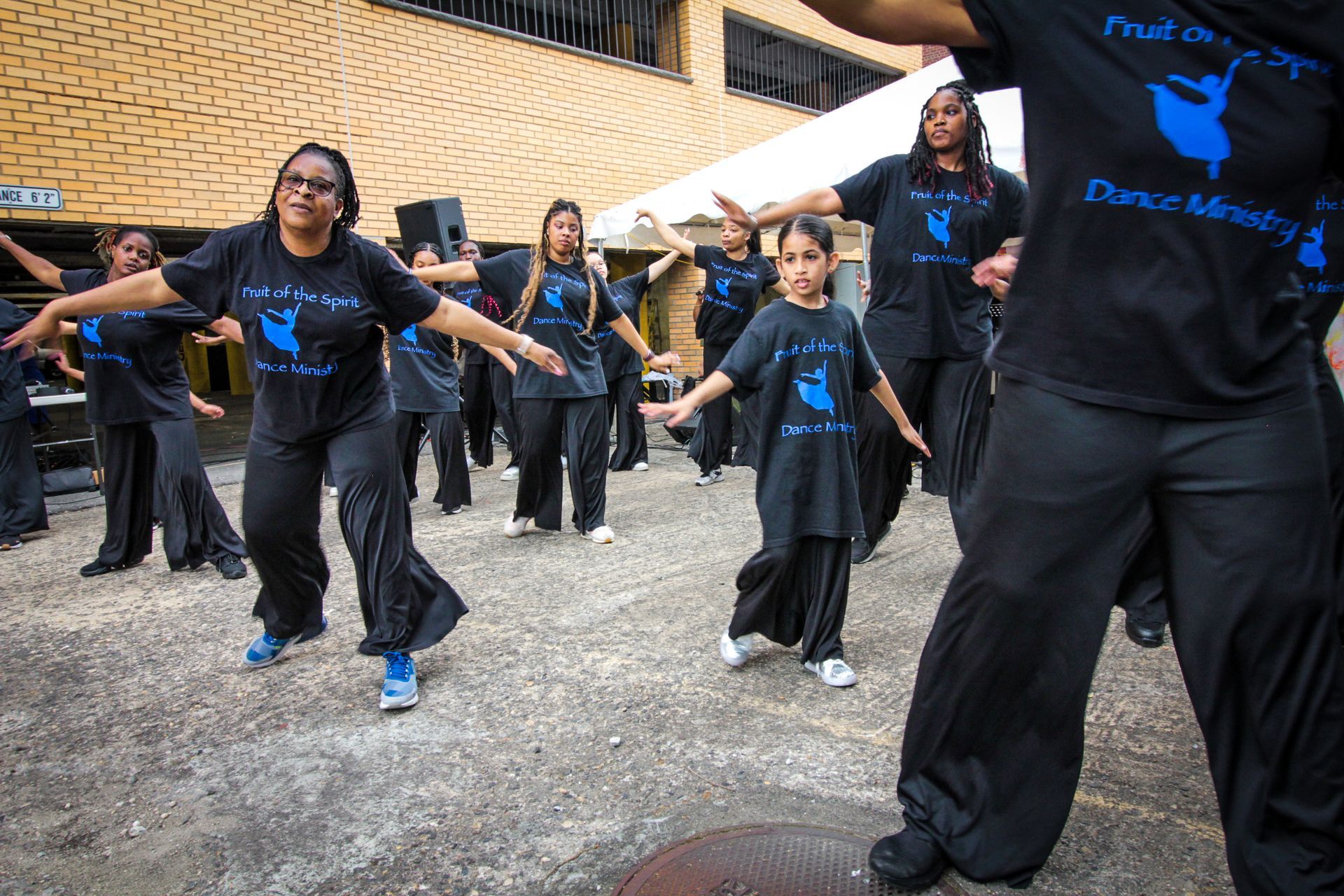 A group of people wearing black shirts that say dance ministry