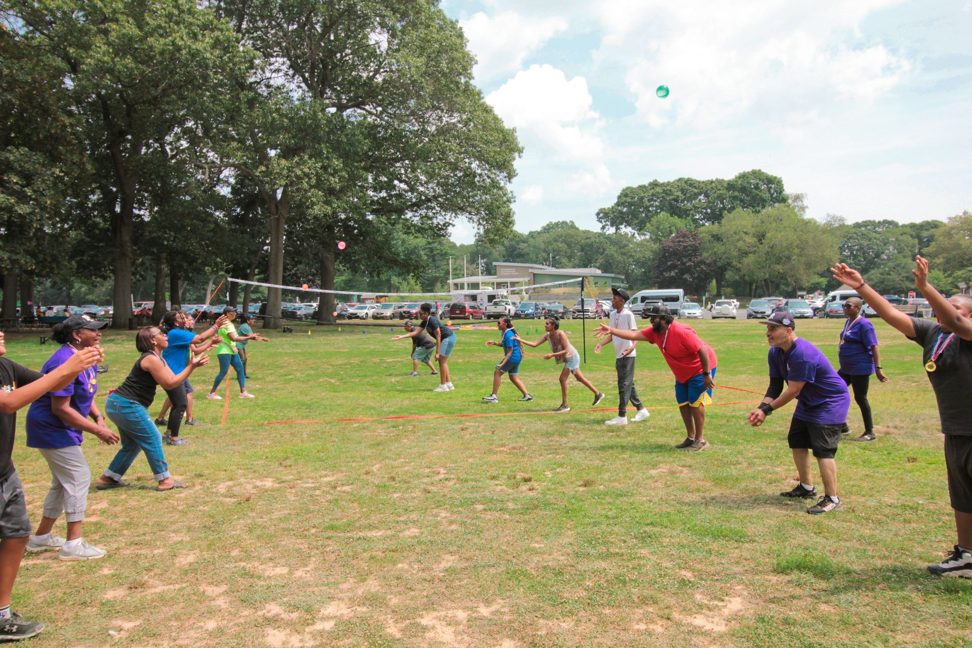 A group of children are playing a game in a field.