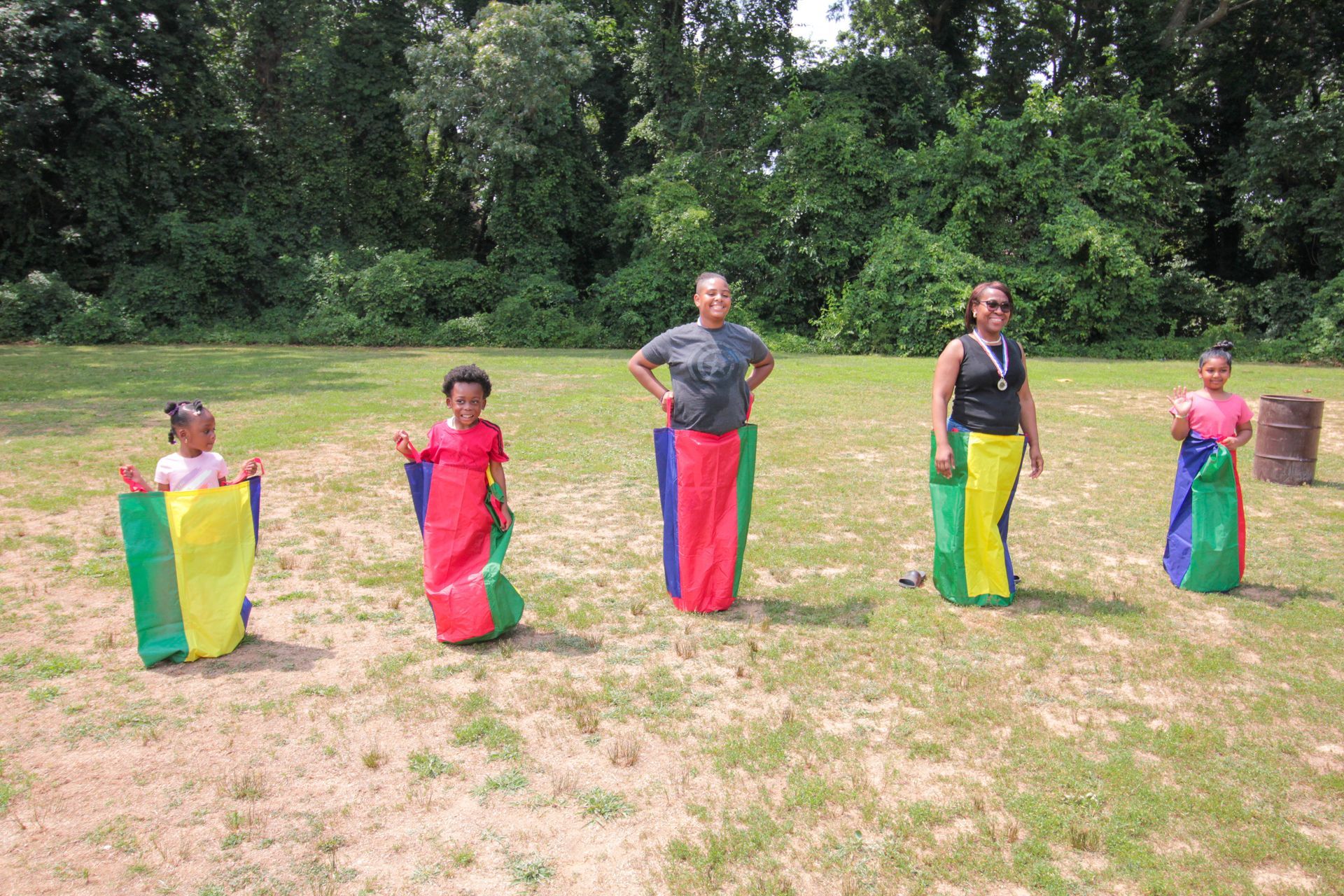 A group of people are playing a game in a field.