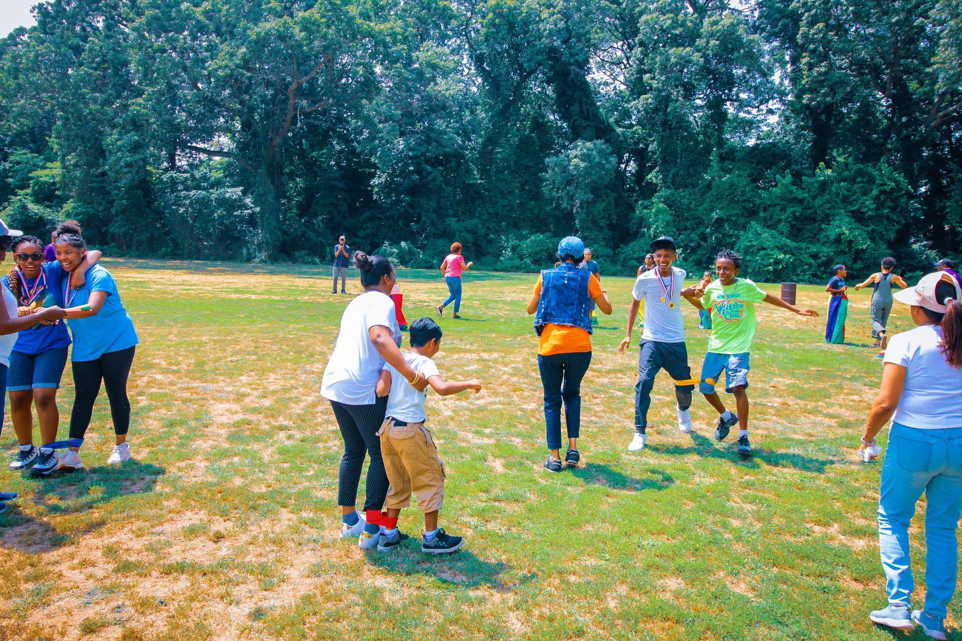 A group of people are playing a game in a field.
