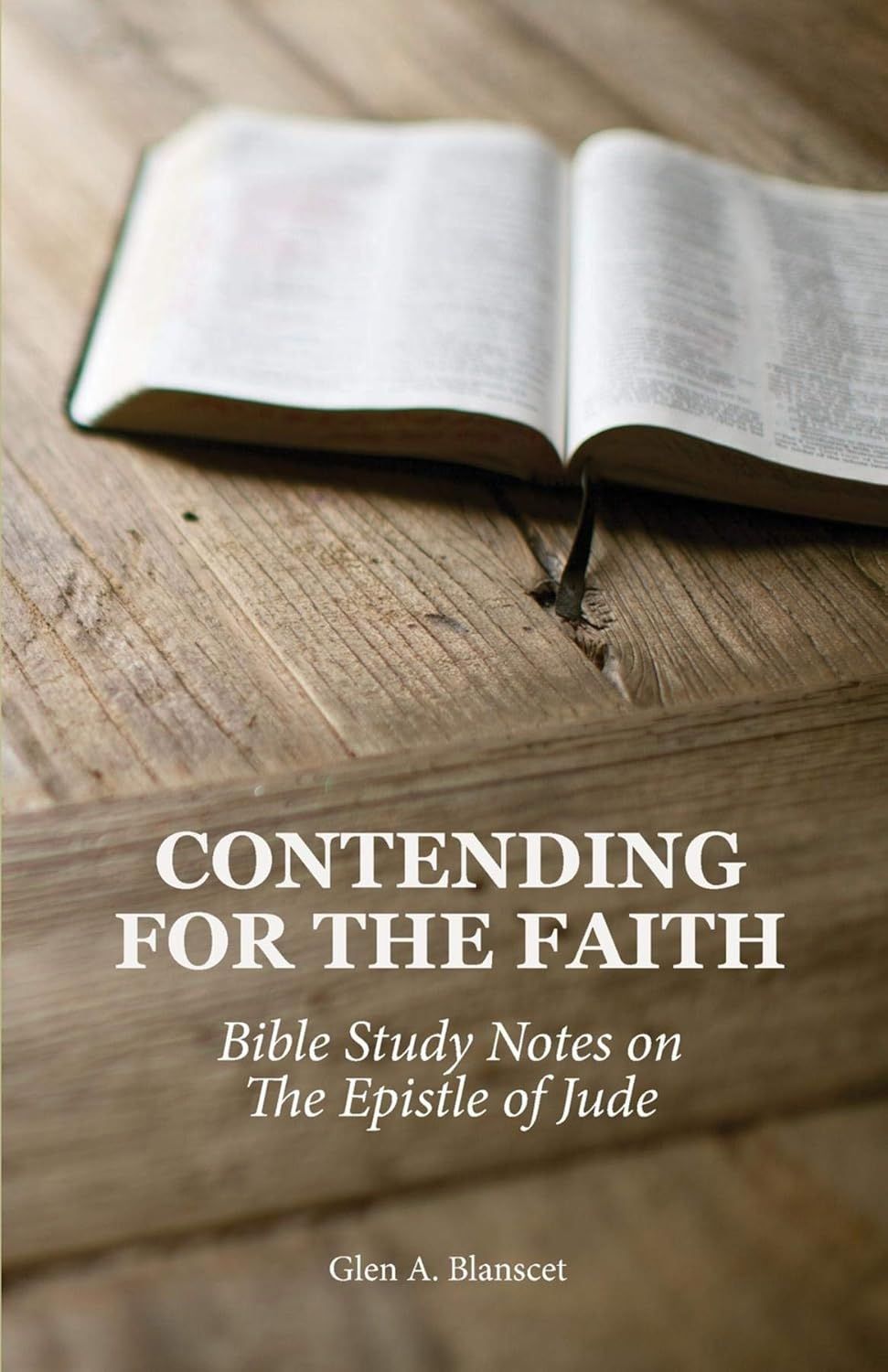 Book cover with an open Bible on a wooden table; title: