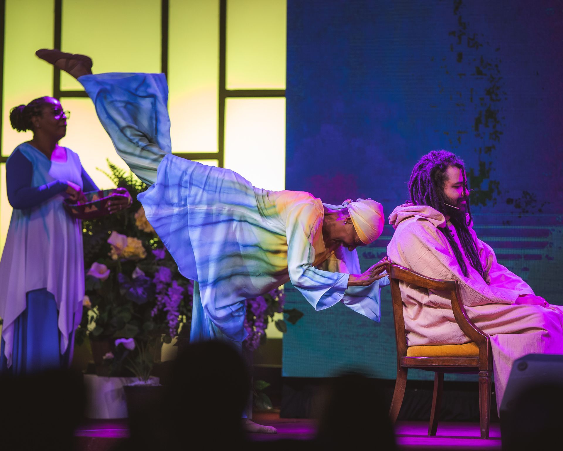 A group of people are performing on a stage.