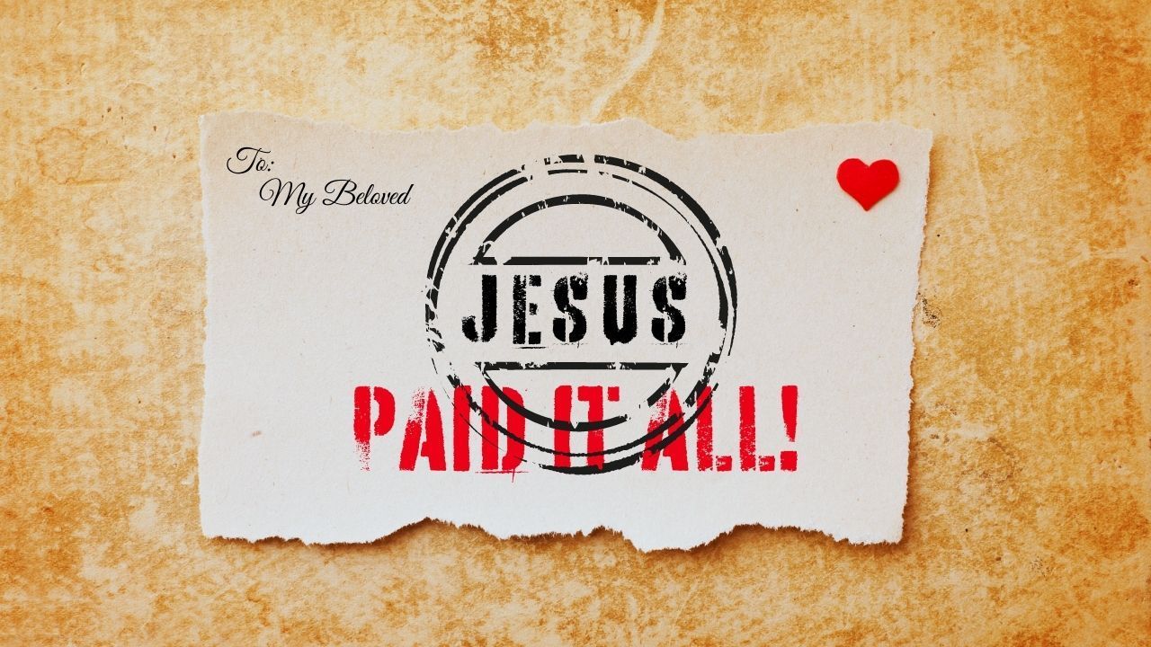 A piece of paper that says jesus paid it all