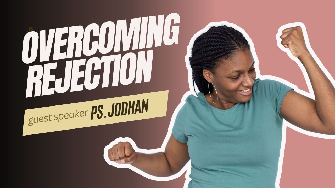 A woman is raising her fist in the air in front of a sign that says overcoming rejection.