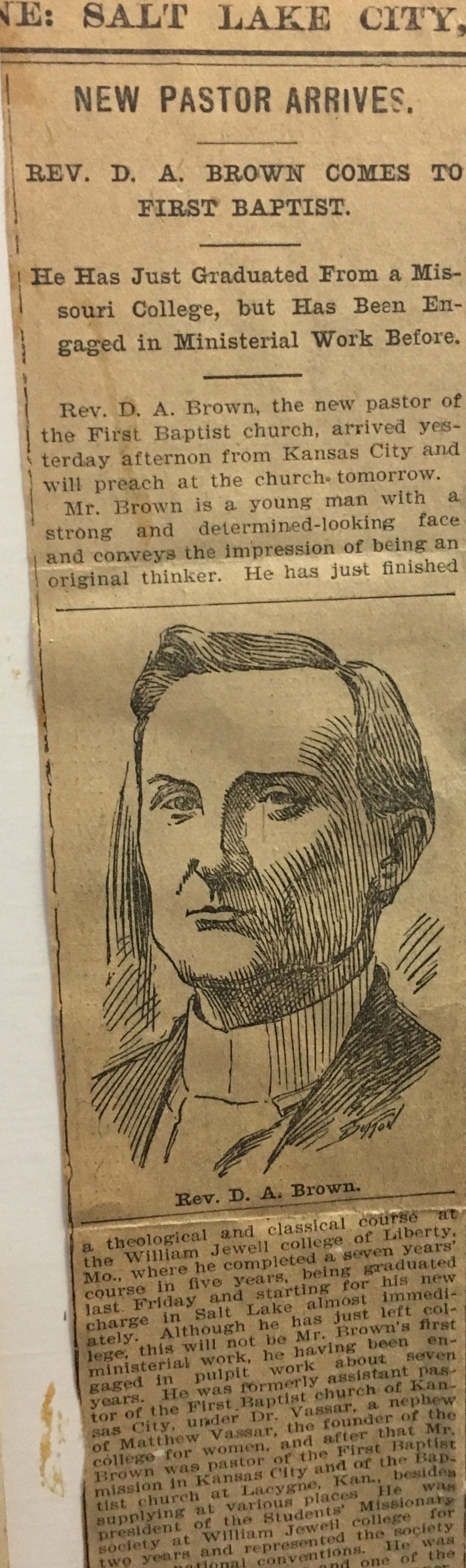 Newspaper clipping: portrait of a man, headshot, with text 