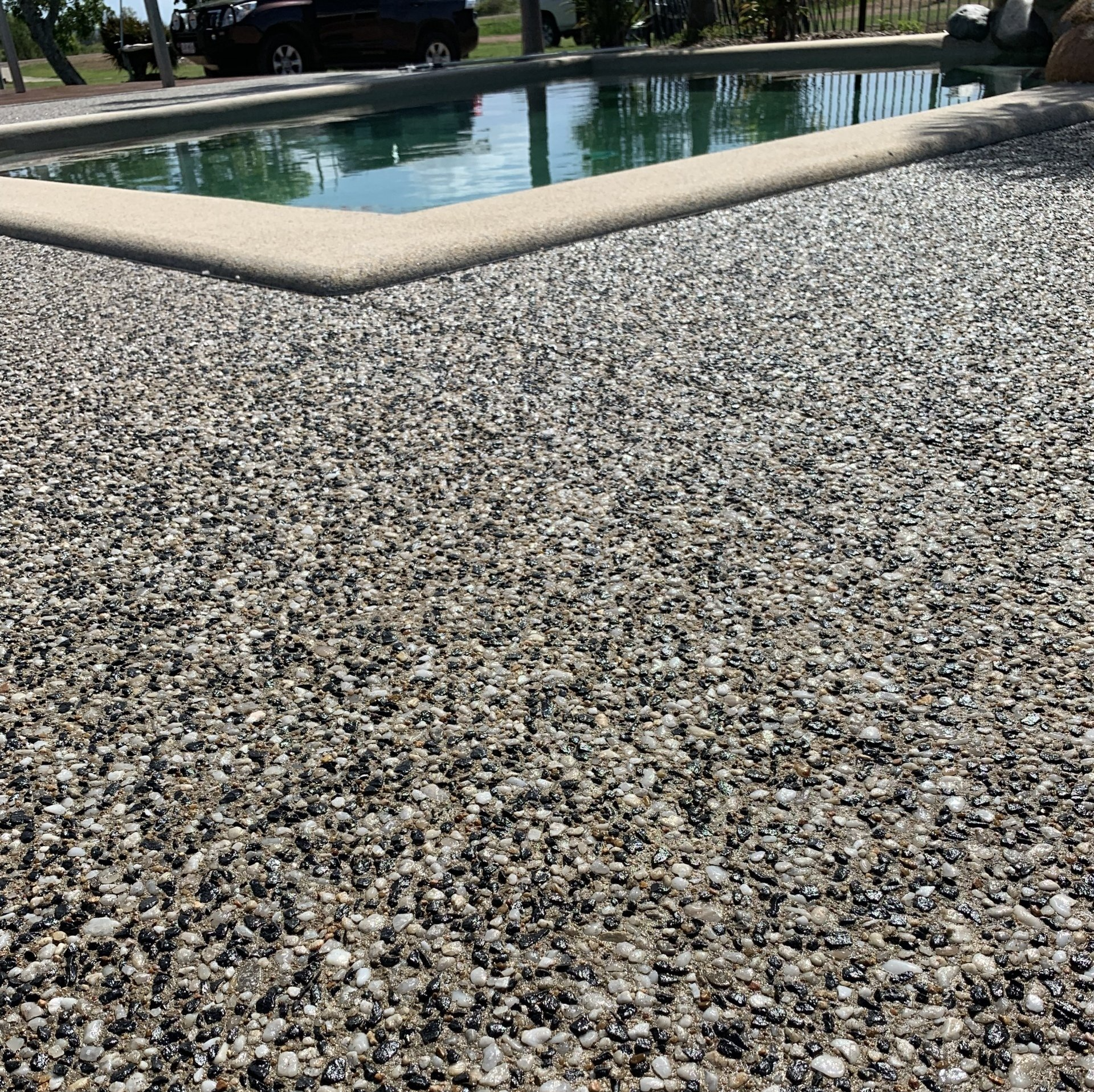 Pebble Concrete Driveway — Outdoor Concreting in Townsville, QLD