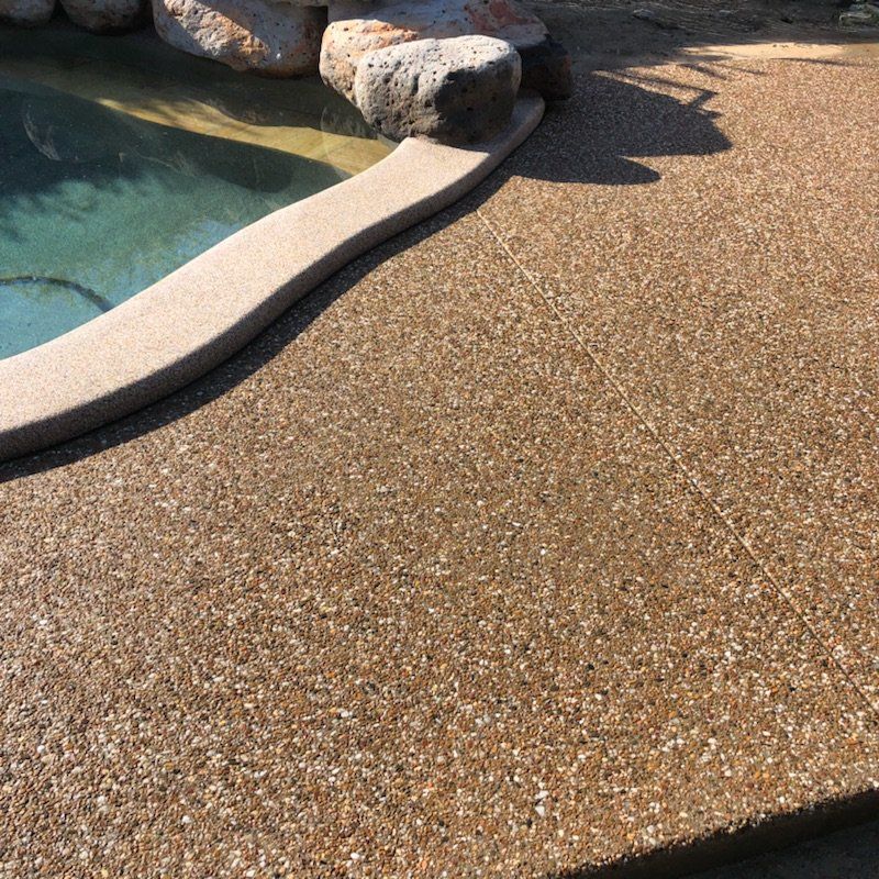Exposed Aggregate Concrete Surrounding Pool — Outdoor Concreting in Townsville, QLD