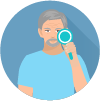 A man with a beard is looking through a magnifying glass.