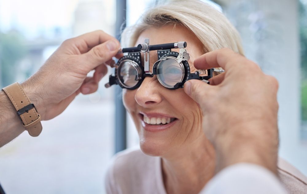 A woman is getting her eyes checked by an ophthalmologist.