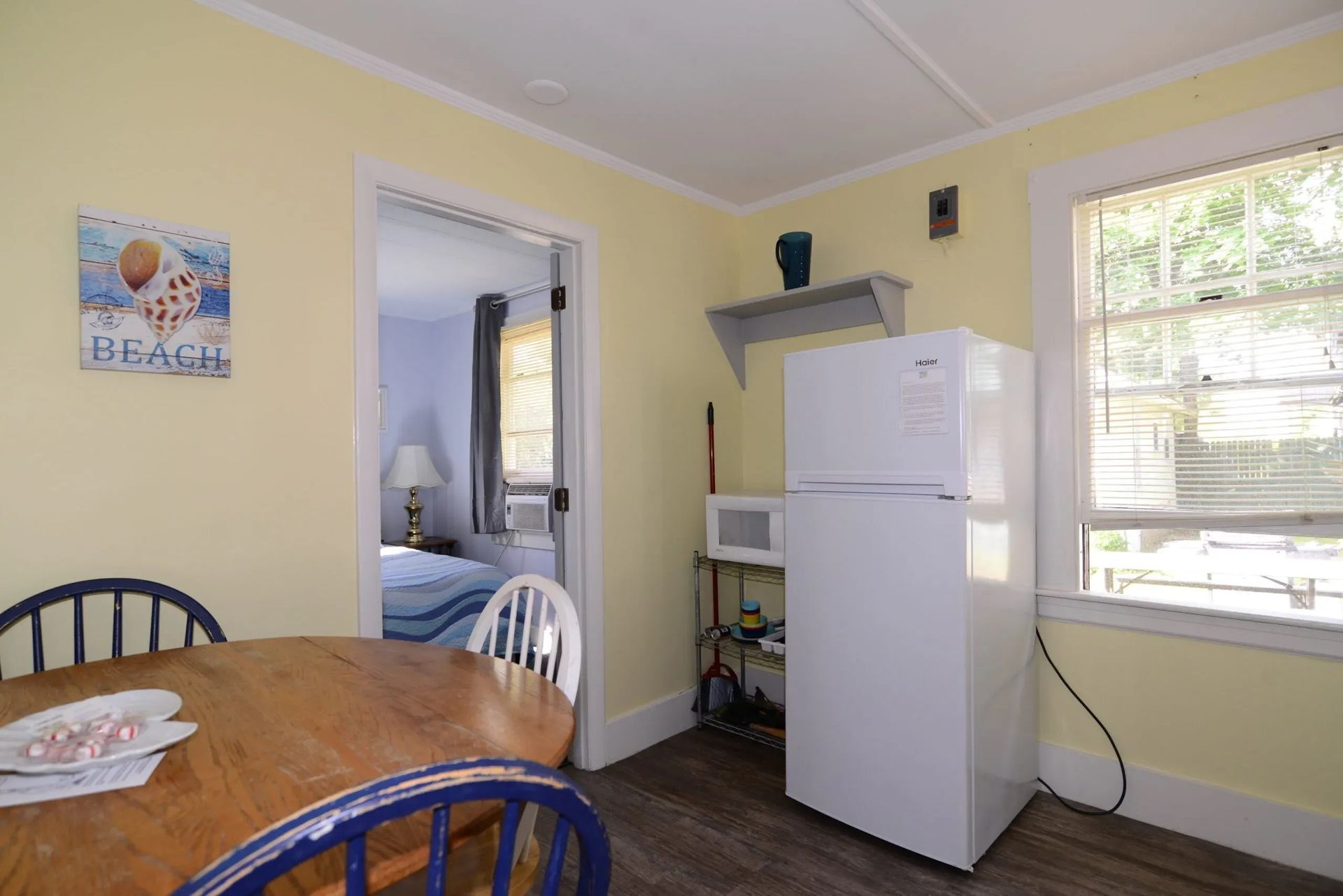 Small kitchen area with a table.