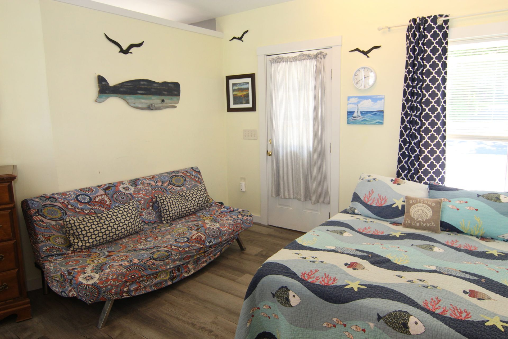 Bedroom with ocean-themed decor.