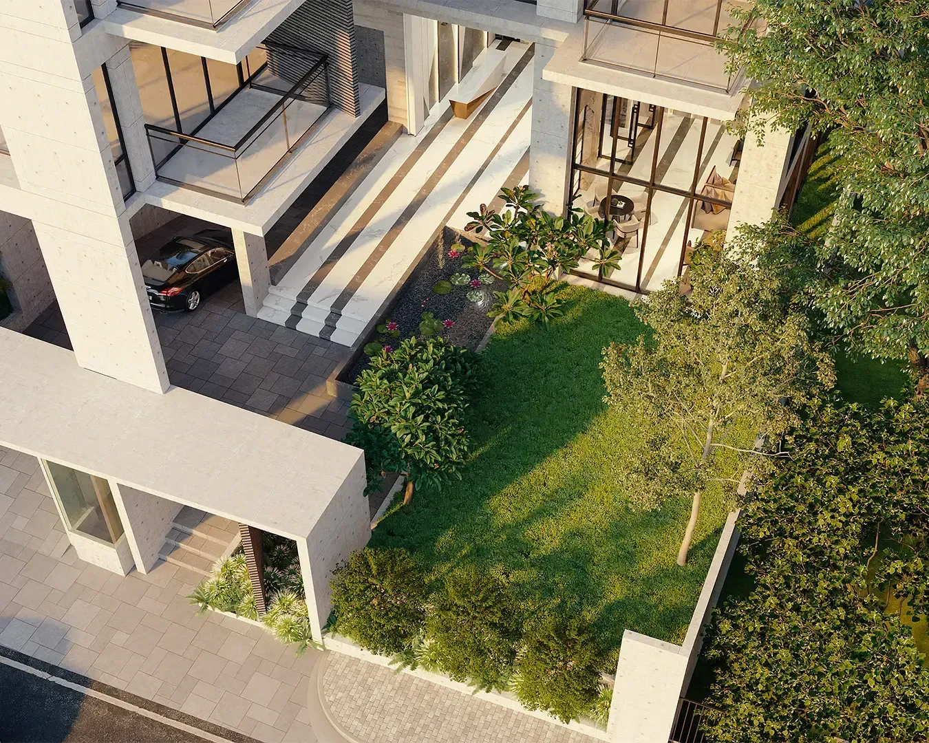 Aerial view of a modern residential building with large glass windows, a lush green garden, trees, and parked cars. The design is sleek and contemporary.