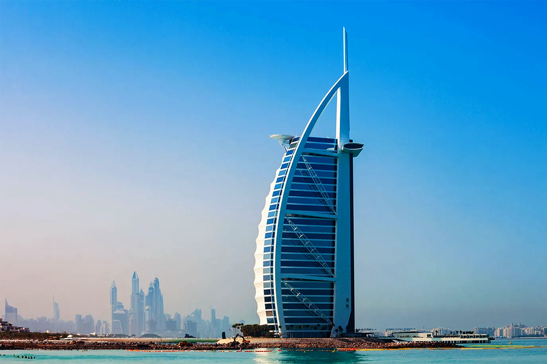 5 Ultra-Luxury Hotels: The Burj Al Arab Jumeirah standing majestically on its private man-made island in Dubai