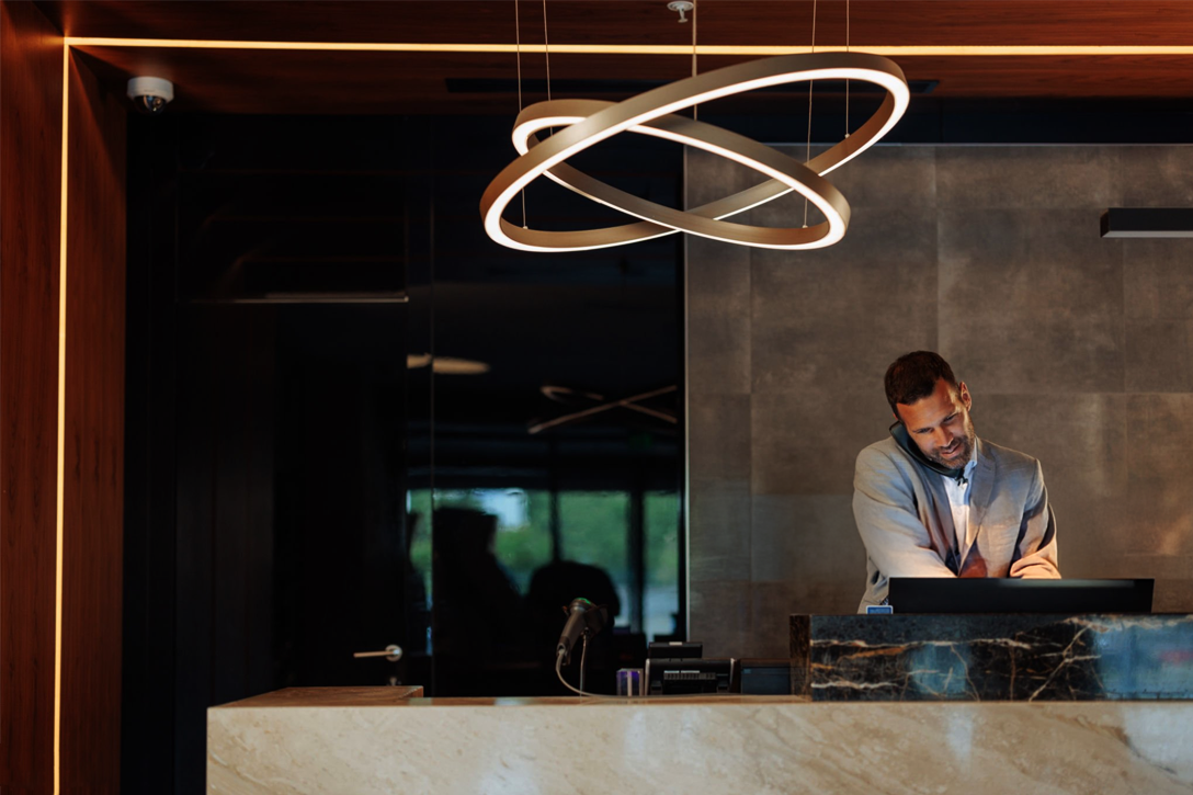 The Midnight Concierge : A tranquil hotel lobby at night, embodying discreet luxury and seamless service.