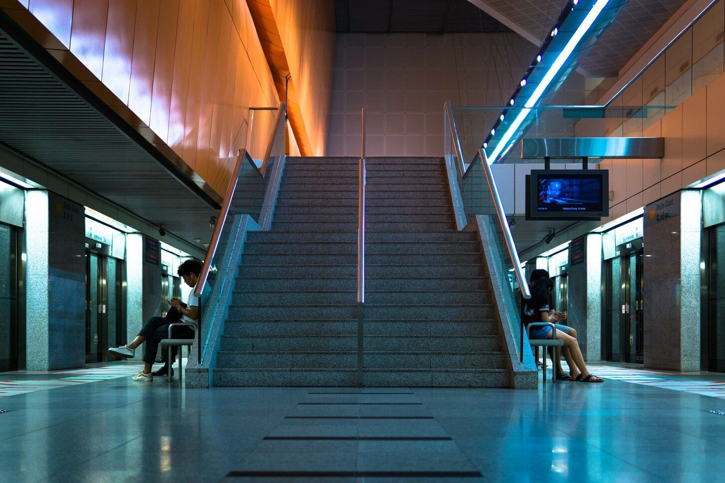 The Assistant's Singapore : Singapore MRT station with clean platforms and clear signage.