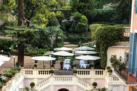 Private Dining Experiences : Morning tranquillity on a private terrace surrounded by lush greenery in Rome.
