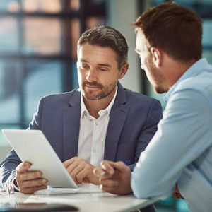 Teamwork meeting, tablet and business people in office workplace. Collaboration, technology and workers, men or employees with touchscreen planning sales, research or financial strategy in company