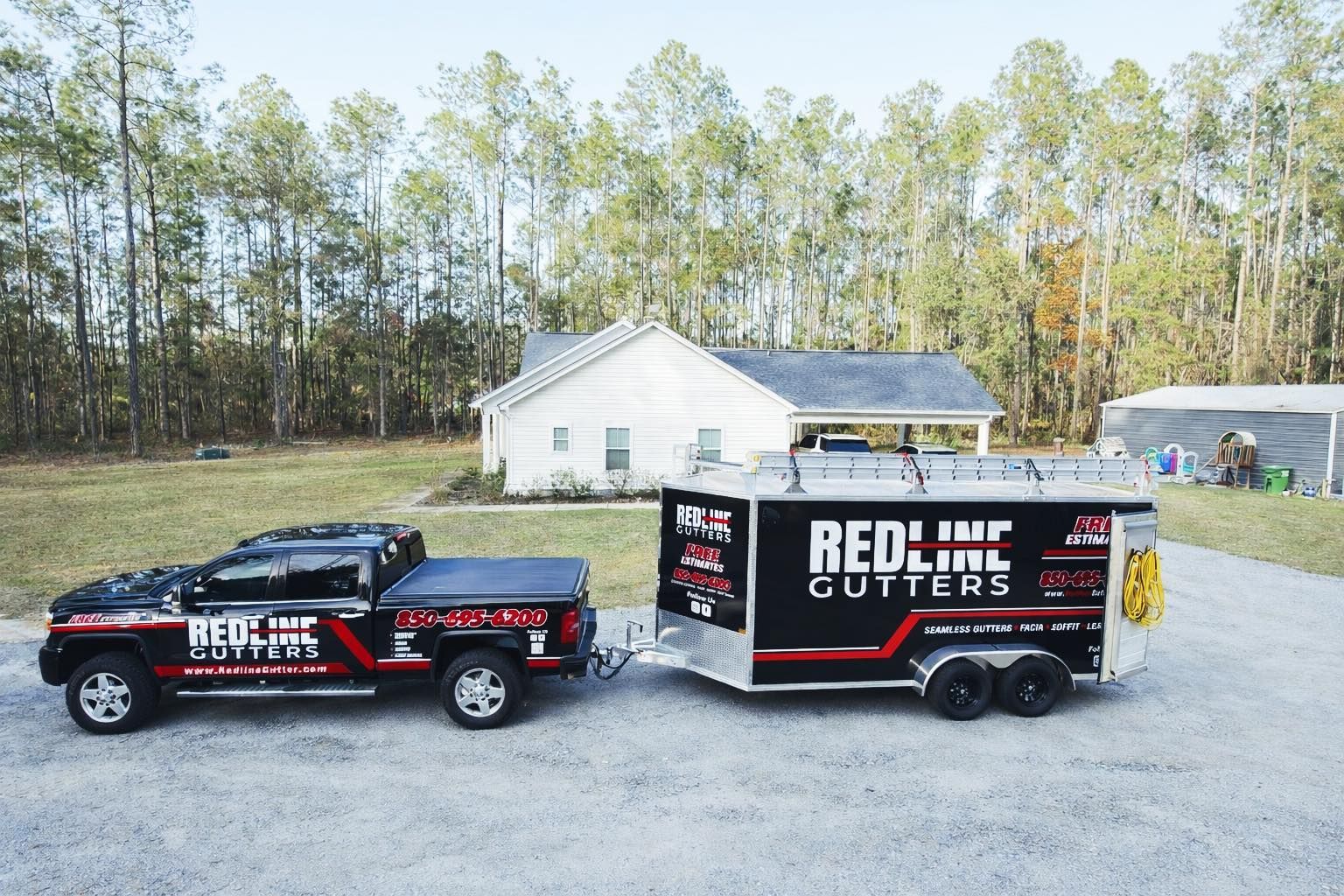 Black truck and trailer, both branded