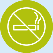 No smoking sign: white cigarette with smoke, crossed out with a diagonal line, on a green circle.