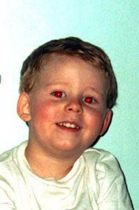 Image of a kid with red eyes from flash