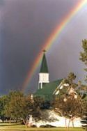 Image of a rainbow over a church