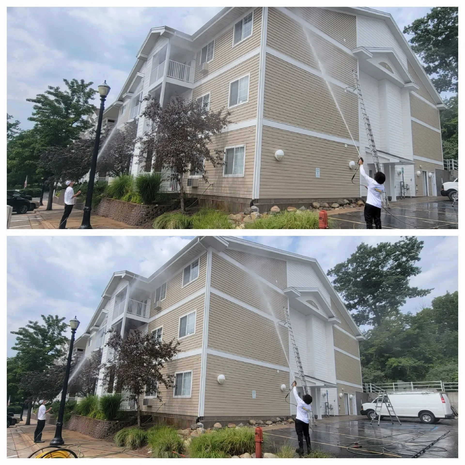 A man is spraying water on the side of a building