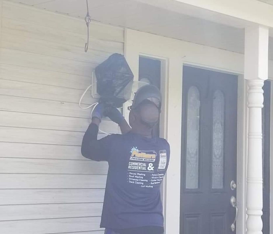 A man wearing a blue shirt that says ' electrical & maintenance ' on it