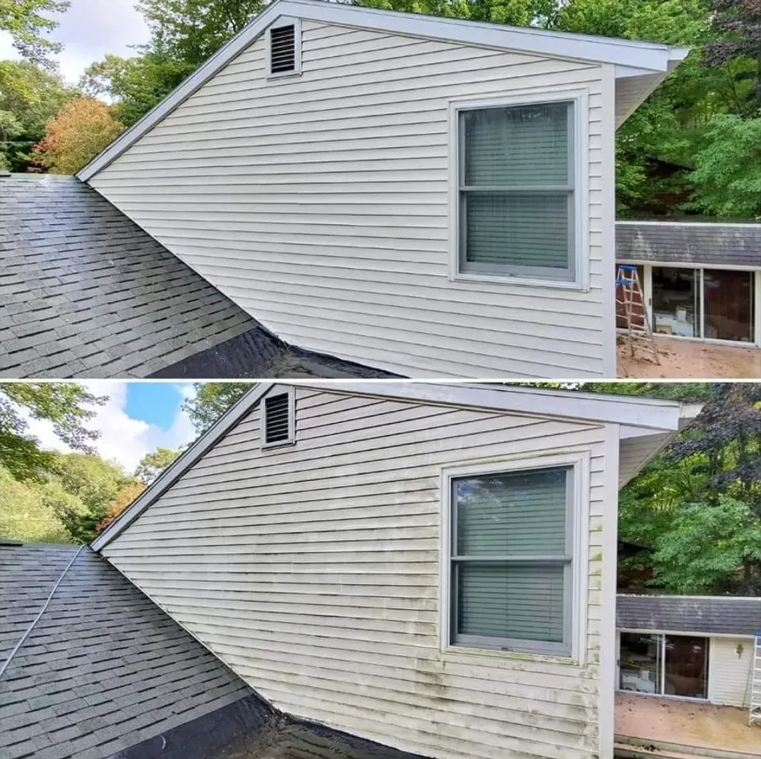 A before and after photo of a house 's siding being cleaned.