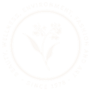Faint logo of a floral design with text, 