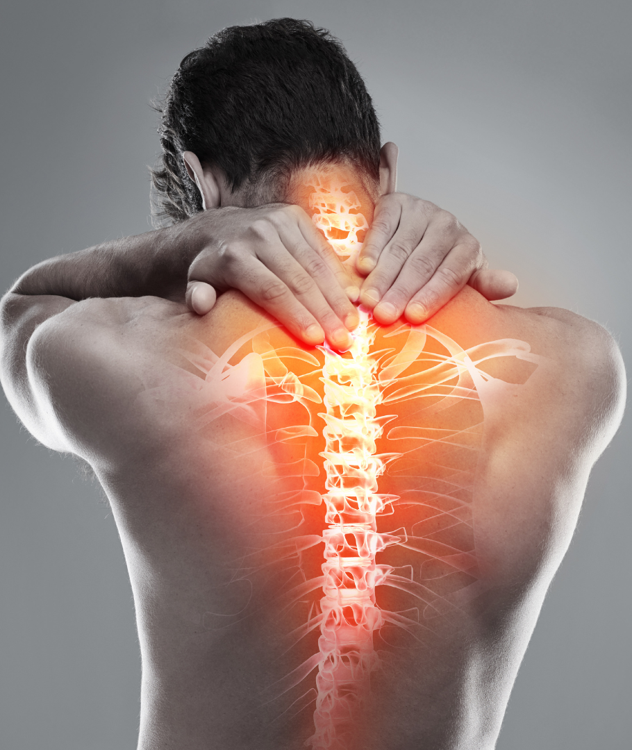A man is holding his neck and back in pain.