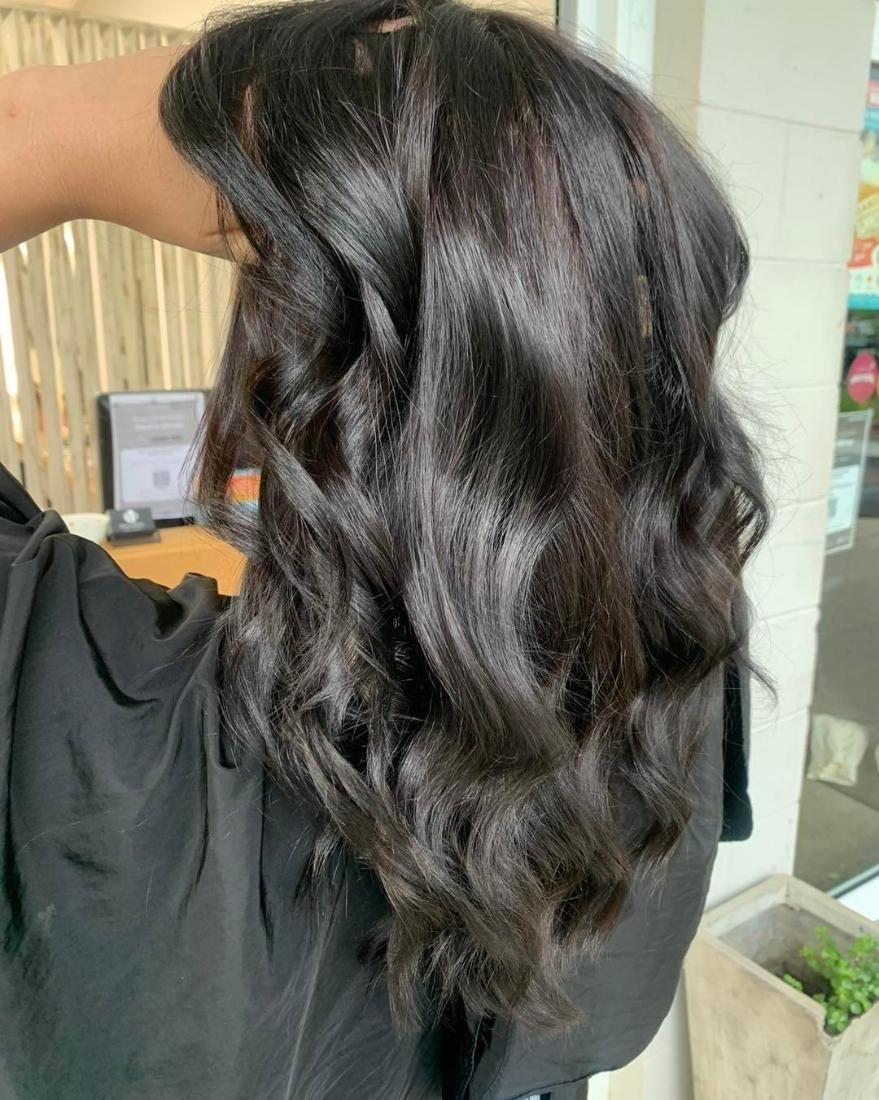 A Woman with Long Dark Hair — Eden Hair in Pacific Paradise, QLD