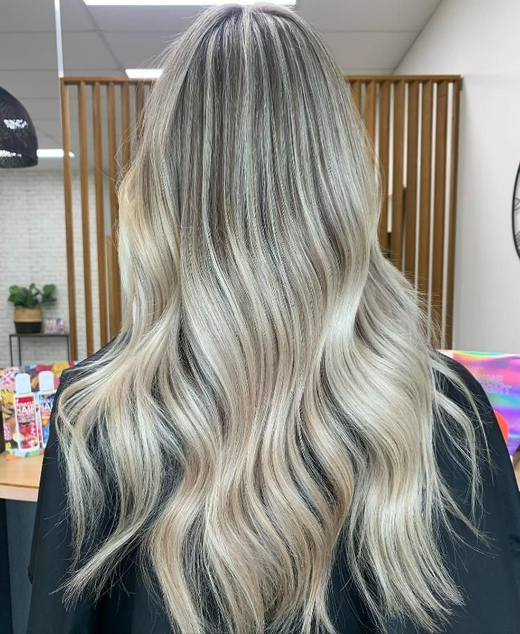 A woman with long blonde hair is standing in a room — Eden Hair in Sunshine Coast, QLD