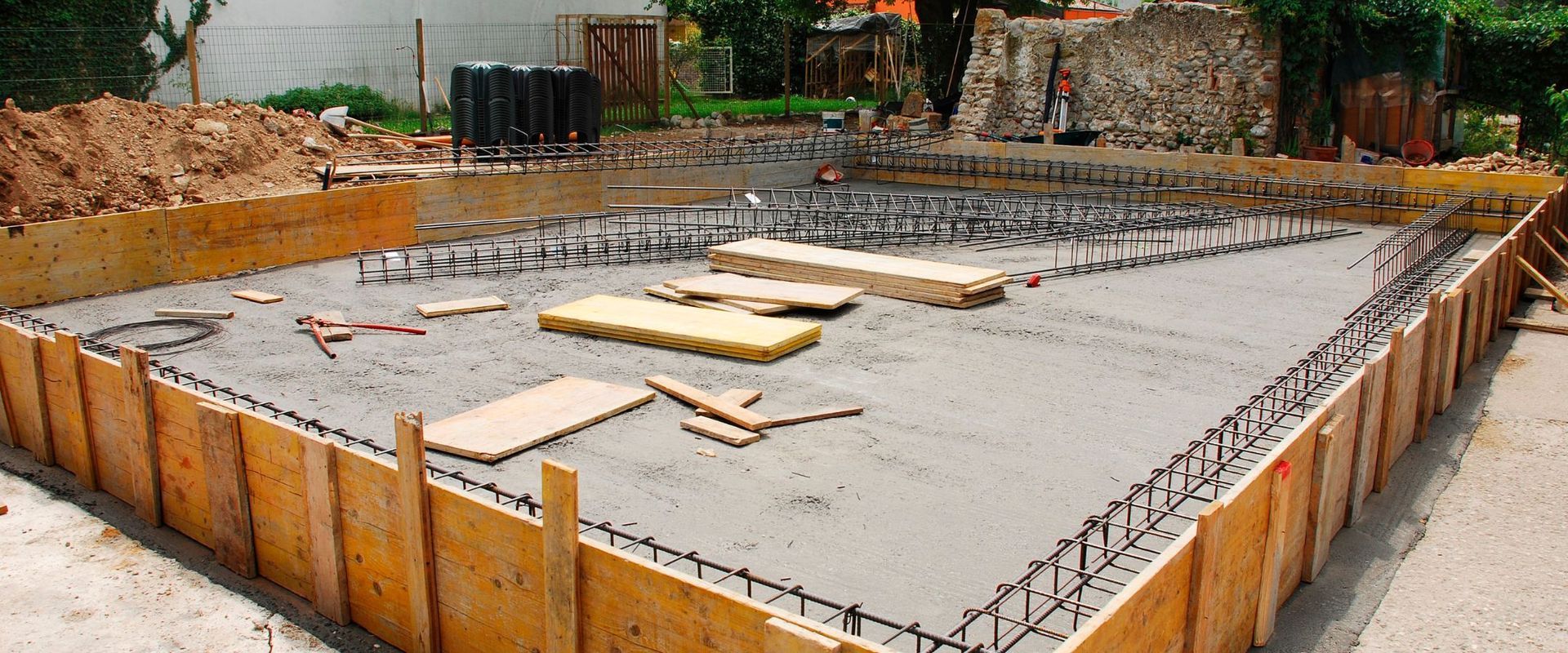 Concrete foundation slab being prepared for installation of partitions.