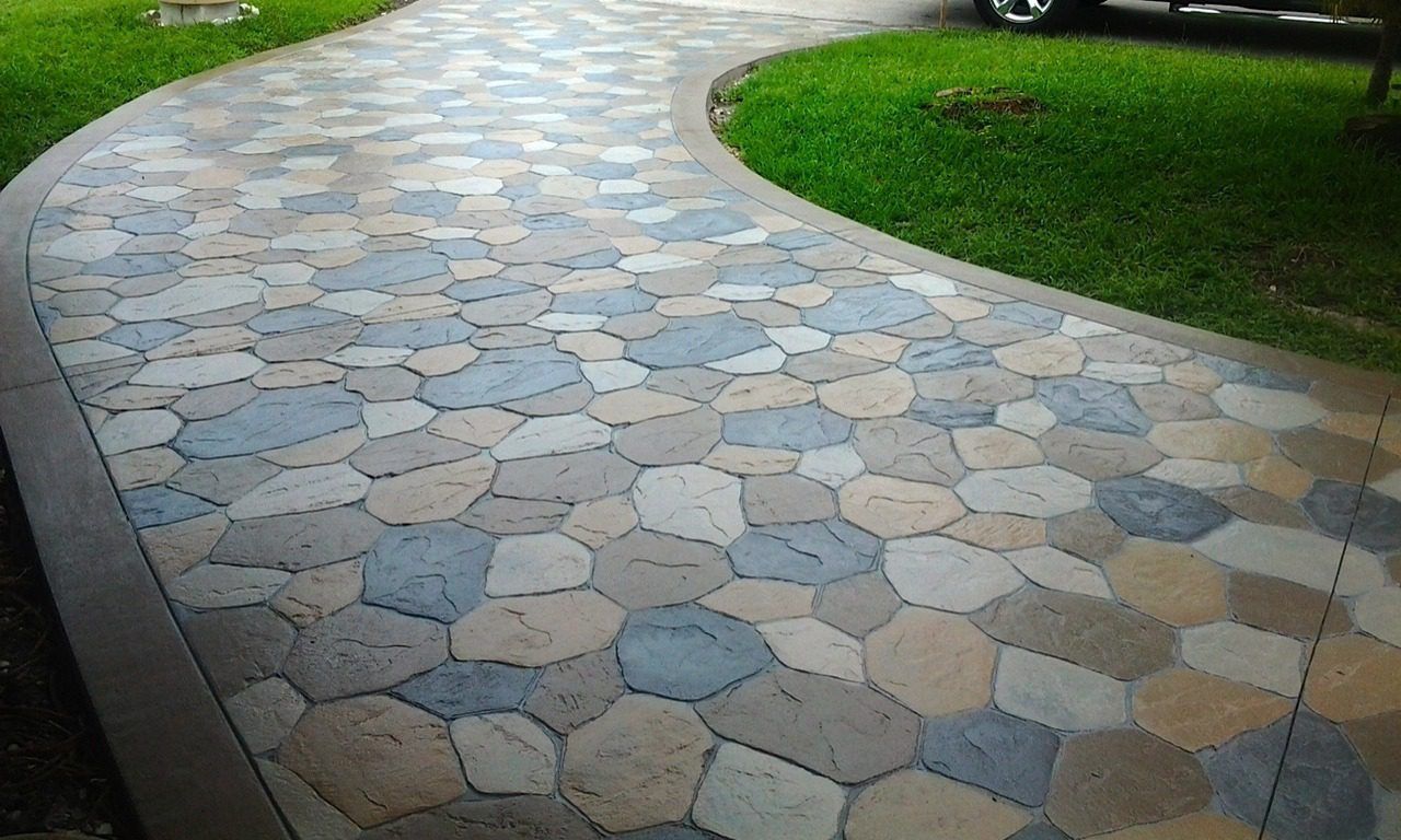 High-quality stamped concrete driveway showcasing decorative stone patterns