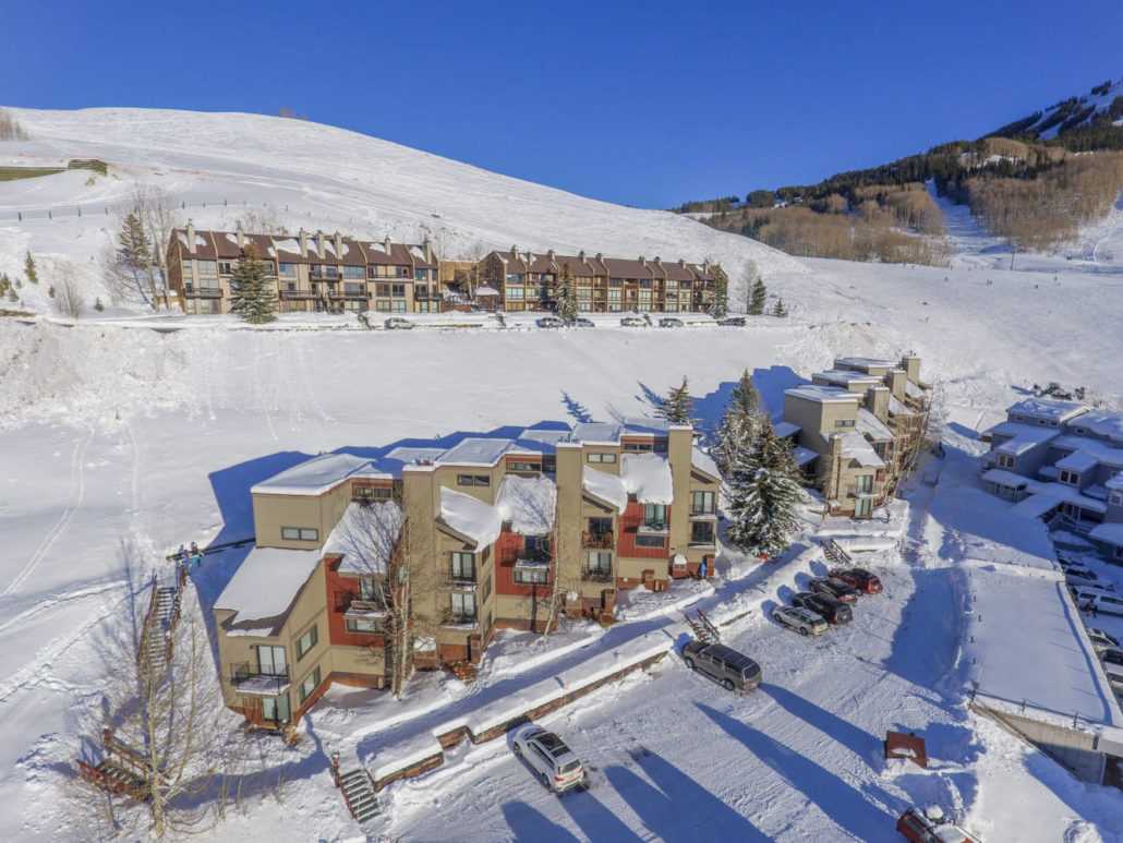 an aerial view of a ski resort covered in snow .