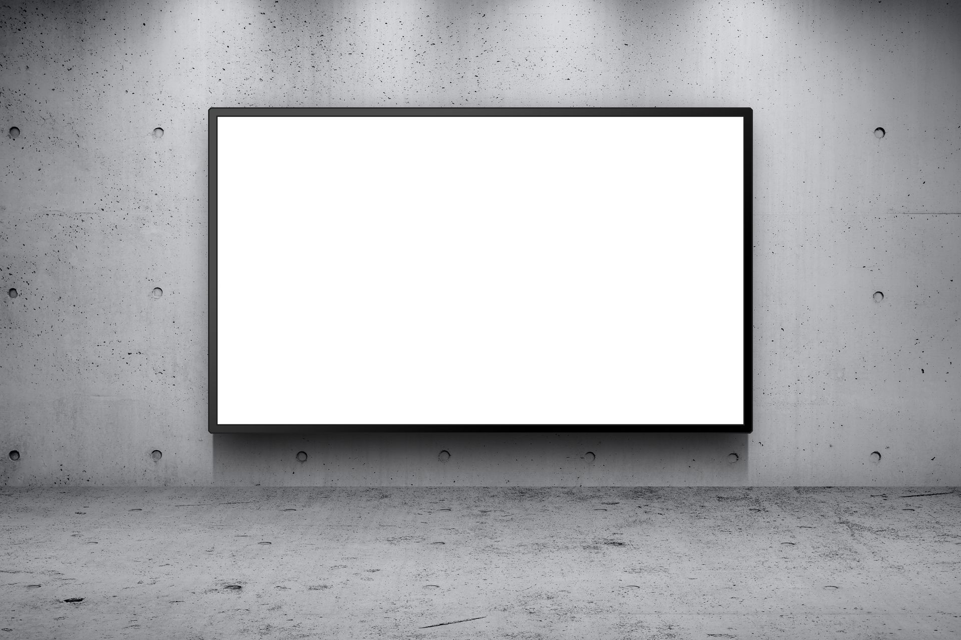Interactive flat panel display products on large LED billboard with concrete wall backdrop.