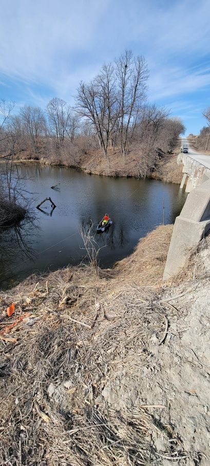 Foaming ocean wave, turquoise water, overhead view, white foam crest.