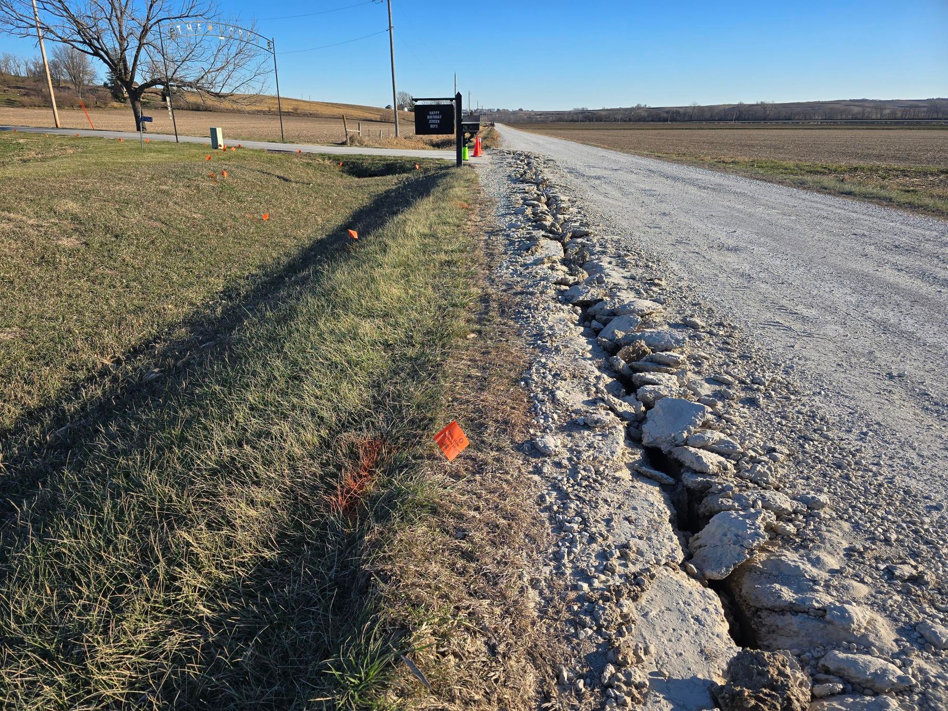Aerial view of a winding river flowing through a dense, green forest.