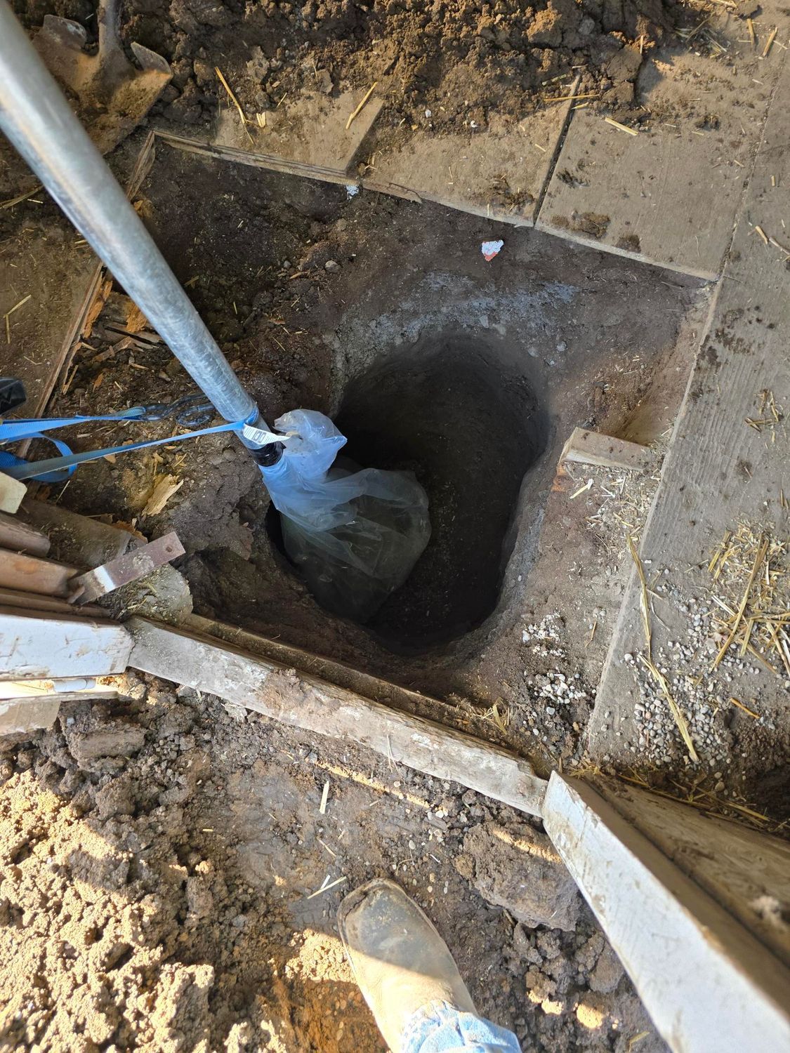 Sandy surface with wave-like patterns and long shadows, bathed in warm light.