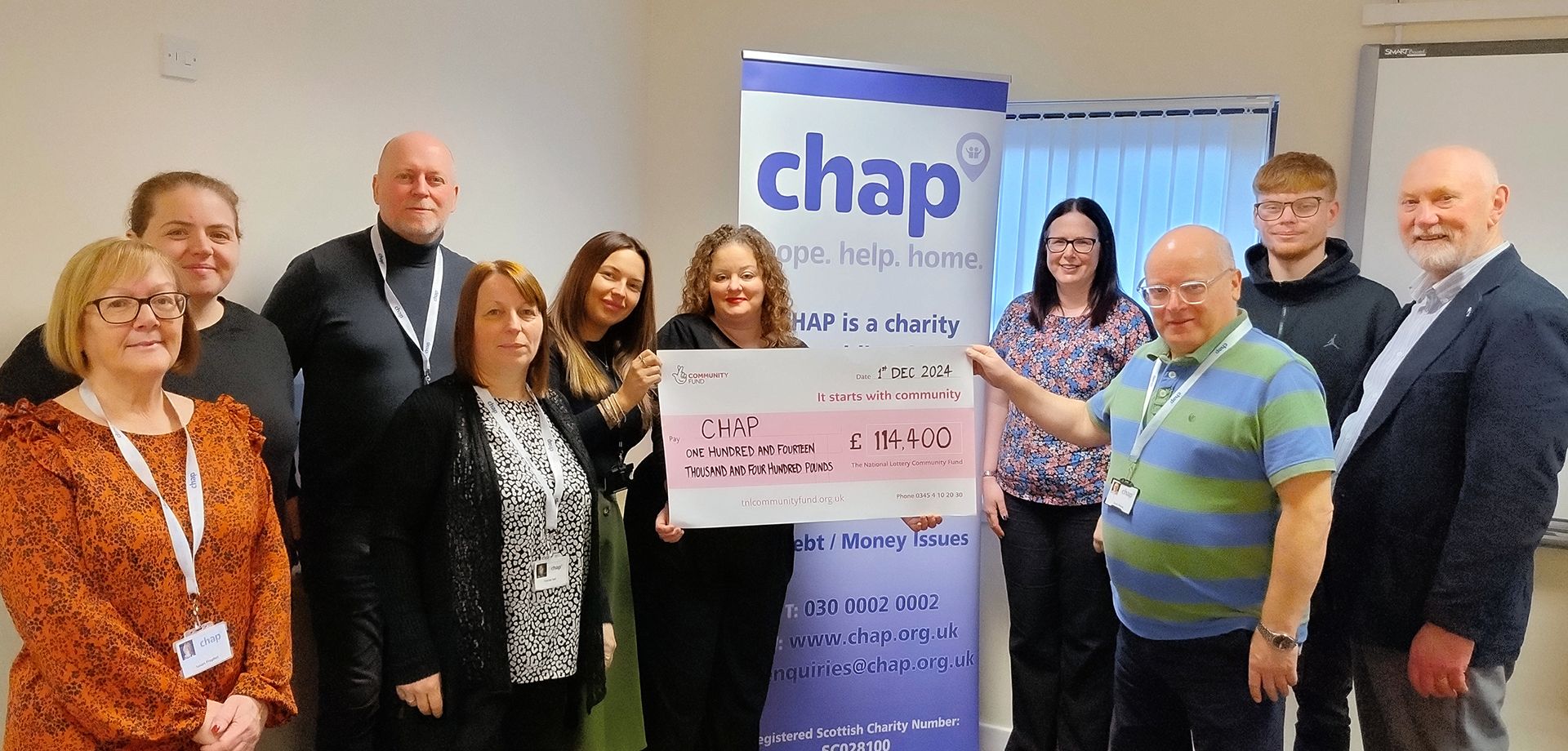 CHAP Staff with Lottery Cheque