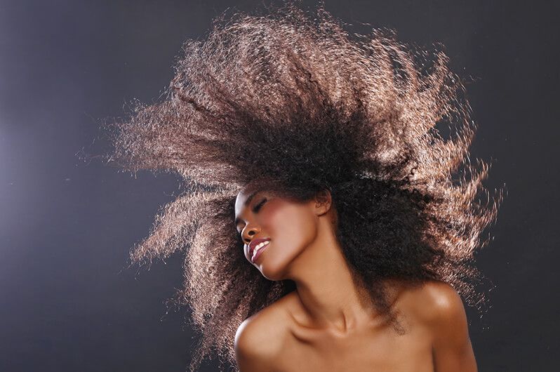 A woman with her hair blowing in the wind