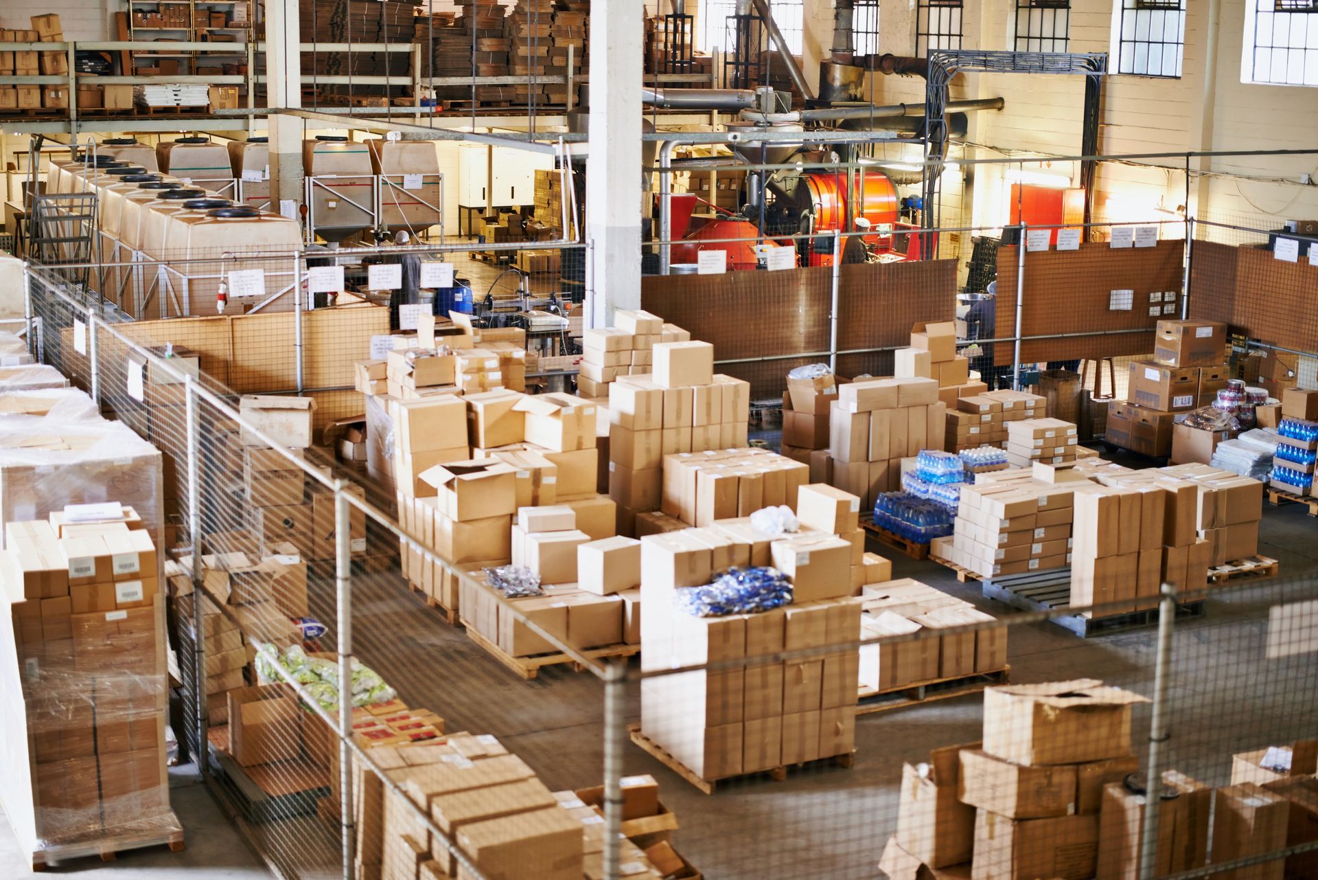 A large warehouse filled with lots of boxes and pallets