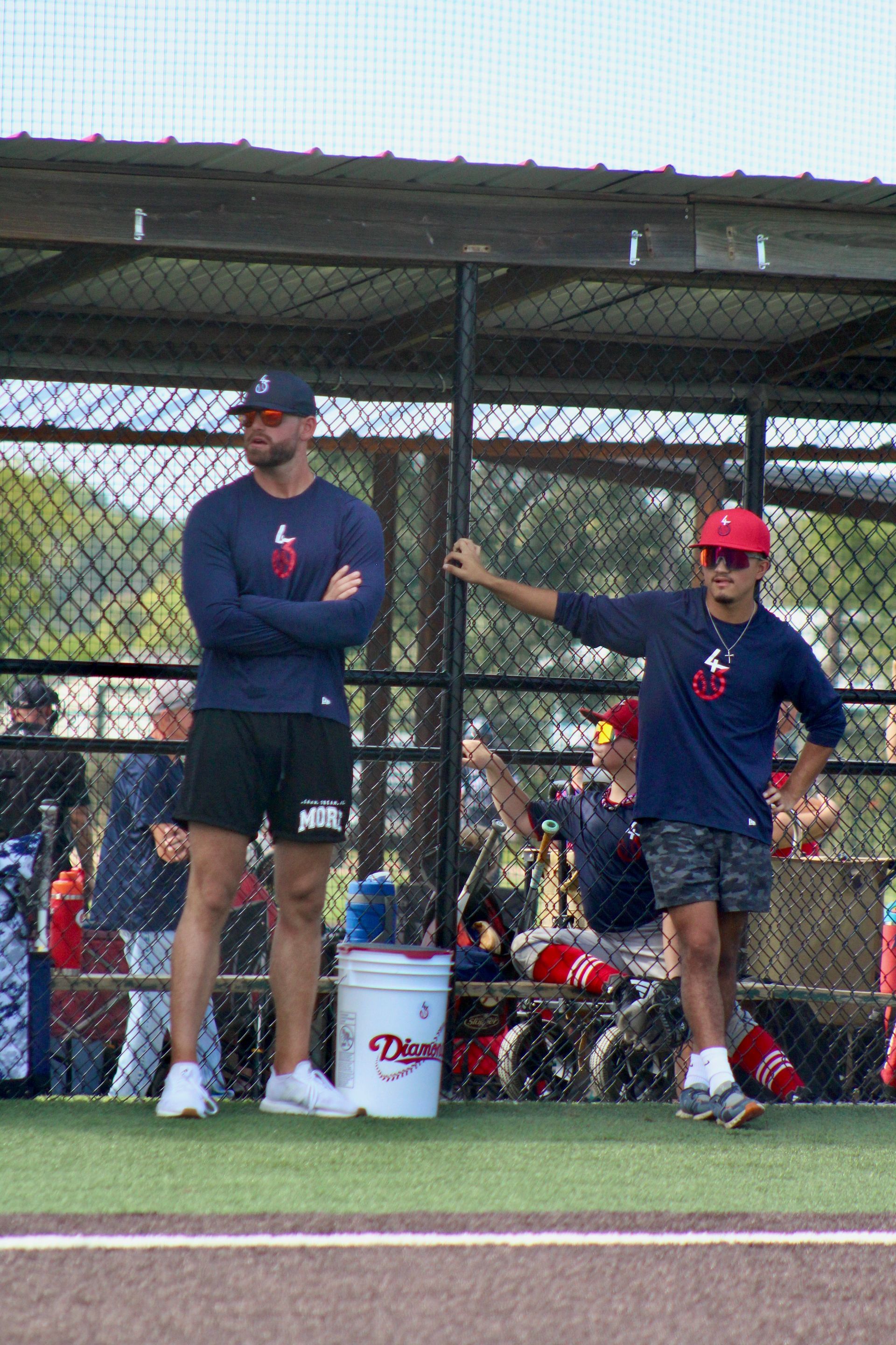 Baseball player in white uniform with number 10 running towards a base on a baseball field.