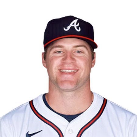 A smiling baseball player in an Atlanta Braves uniform and cap.