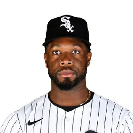 A baseball player in a white and black uniform with the White Sox logo.