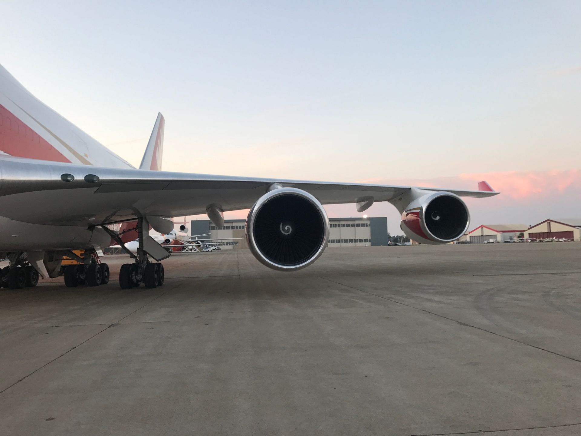 A large passenger jet is parked on the tarmac at an airport