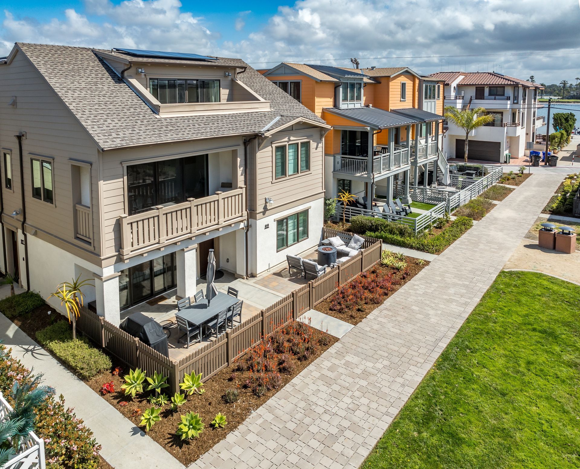 An aerial view of a row of houses in a residential area.