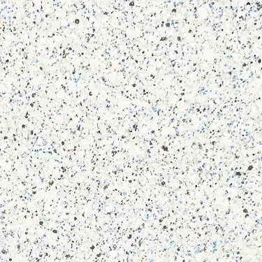 A close up of a white granite counter top with black and blue spots.